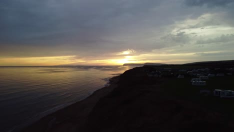 Footage-flying-forwards-over-the-coast-of-the-Isle-of-Wight-at-sunset