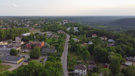 Main-road-of-Sigulda-town-in-Latvia,-aerial-drone-view