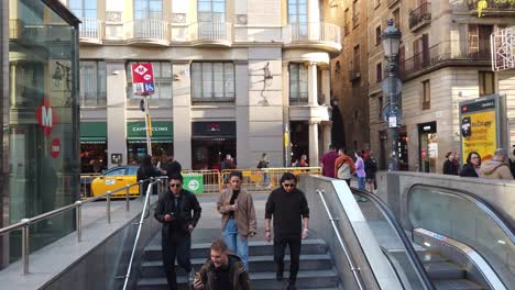 People-Travel-Enter-the-Underground-Metro-at-Gothic-Barcelona-Streets-in-Autumn