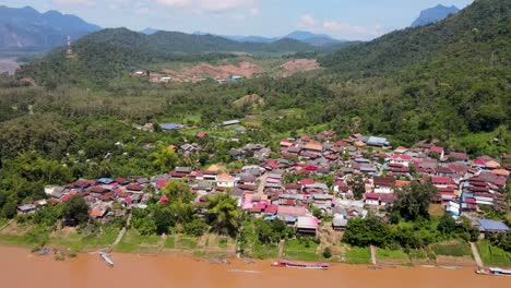 Aerial-View-Of-The-Whisky-Village-In-Luange-Prabang-Beside-The-Mekong-River-In-Laos