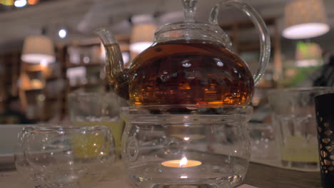 Glass-teapot-on-the-table-in-restaurant