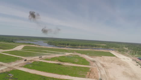 Military-trucks-driving-during-playwar-aerial-view