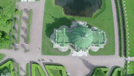 Flying-over-ancient-building-and-pond-in-Tsaritsyno