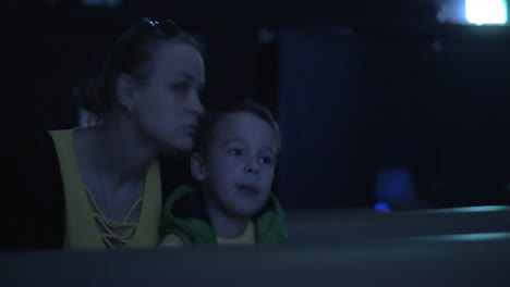 Mom-and-kid-spending-leisure-at-the-cinema