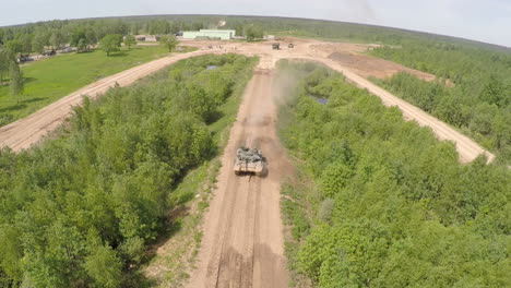 Flying-over-the-tank-on-rough-ground-of-training-area