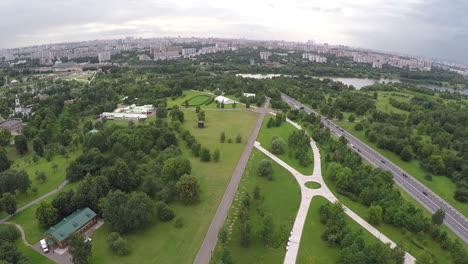 Flying-over-the-city-with-vast-green-plantations