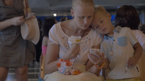 Mother-and-child-in-waiting-room-of-the-airport