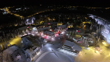 Flying-over-winter-resort-at-night-Finland