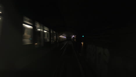 Underground-train-coming-to-the-station-from-dark-tunnel