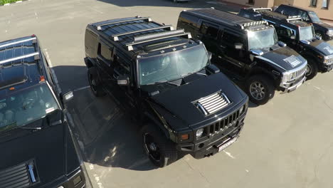 Hummer-vehicles-on-parking-lot-aerial-view