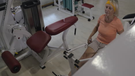 Senior-woman-working-out-on-exercise-machine