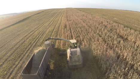 Harvesting-crops-on-vast-farmlands-aerial-view