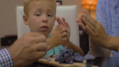 Child-and-parents-modeling-with-playdough