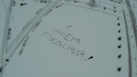 Happy-Birthday-written-on-the-snow-aerial-view
