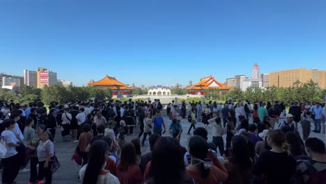 Scene-of-tourists-walking-outside-the-entrance-at-Chiang-Kai-shek-Memorial-Hall,-a-national-monument-in-Taipei,-Taiwan