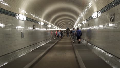 Under-the-city-of-Hamburg-people-walking-to-catch-different-subway-trains