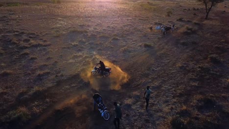 Motorcycle-Gang---Rider-Fell-Off-from-The-Motorcycle-While-Doing-Drifts-On-The-Dusty-Field-At-Sunset