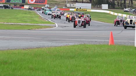 Winton,-Victoria,-Australia---29-May-2022:-Cars-parading-around-the-race-track-at-the-all-historic-motorsport-event-at-Winton-in-2022
