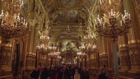 Tourists-Taking-Photos-and-Walking-Inside-of-Grand-Foyer-of-Palais-Garnier