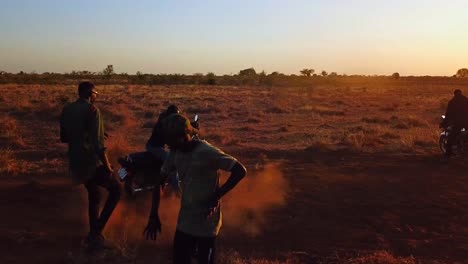 Karamojong-Tribe-Rappers-Dancing-To-Hip-Hop-Music-In-The-Field-During-Sunset-In-Uganda