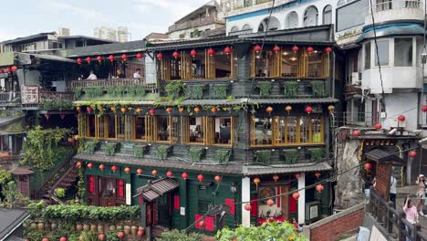Point-of-view-of-the-iconic-A-Mei-Tea-House,-located-on-Jiufen-Old-Street,-is-perched-on-a-steep-mountainside-with-tea-ceremonies-and-terrace-views-in-New-Taipei-City's-Ruifang-District,-Taiwan