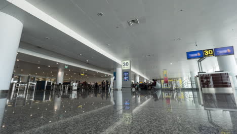 Timelapse-of-people-walking-in-airport-hall-and-security-checkpoint