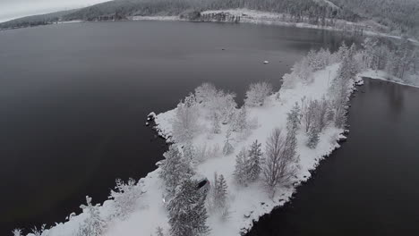 Car-on-the-Dike-through-the-Lake-Drone-Shot