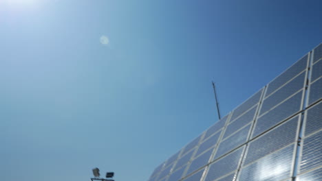 In-blue-sky-seen-bright-sun-then-seen-solar-panels