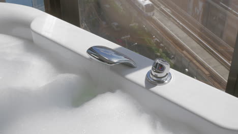 Woman-is-going-to-take-bath-with-foam