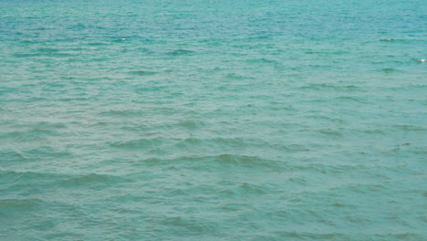 Beautiful-view-of-the-sea-with-small-gentle-waves-Summer-day-with-breeze-and-bright-sun