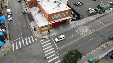 Aerial-tilt-shot-in-front-of-the-LAFD-Fire-Station-9,-in-SkidRow,-Los-Angeles