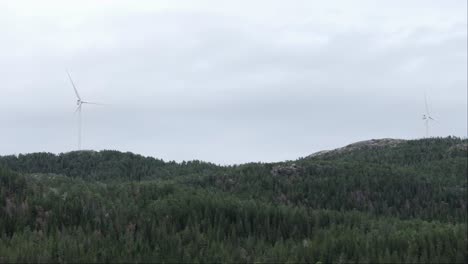 Windmills-On-Green-Hills-In-Hildremsvatnet,-Norway---wide-shot