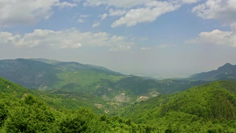 Aerial-drone-flight-over-green-mountains-of-Rhodope-during-sunny-day-in-Bulgaria