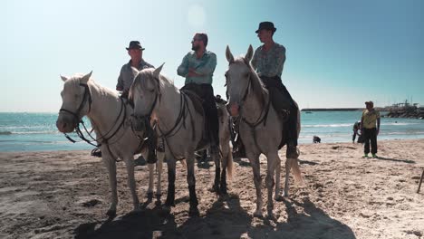 Cinematic-shot-of-riders-waiting-on-the-beach-during-the-Palavas-Feria