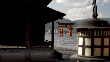 Itsukushima-Shrine-behind-some-japanese-buildings-on-Miyajima-island