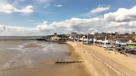 Southend-Beach-drone-flight-to-Adventure-Island-theme-park,-Essex-UK