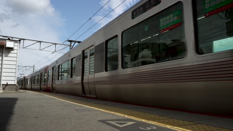 Red-Wing-JR-West-227-Series-Train-Approaching-Mitaki-Station,-Hiroshima