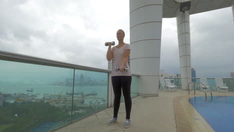 Woman-working-out-on-rooftop-in-Hong-Kong