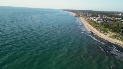 Fixed-Aerial-Shot-over-Cottesloe-Beach-Waves-Perth-Coastline,-Australia