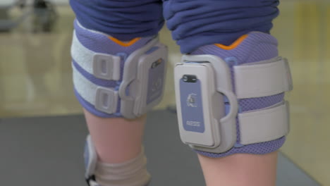 In-Nea-Kallikratia-Greece-in-clinic-little-boy-slowly-walks-on-the-medical-treadmill-with-an-electronic-device-on-legs