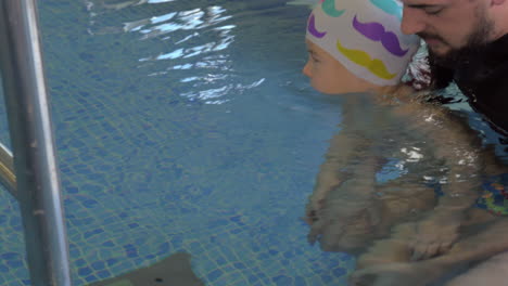 Rehabilitation-Centre-Evexia-small-boy-and-teacher-in-swimming-pool