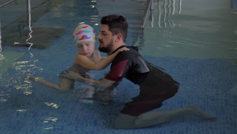 Child-undergoing-therapy-in-water