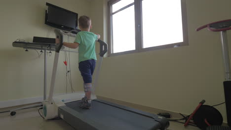 In-Nea-Kallikratia-Greece-in-clinic-little-boy-slowly-walks-on-the-medical-treadmill