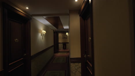 Seen-long-hotel-corridor-with-glowing-lights-and-doors-from-the-rooms