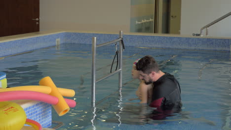 Child-doing-treatment-exercises-in-therapeutic-pool