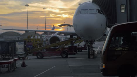 Boarding-and-loading-airplane-at-sunset