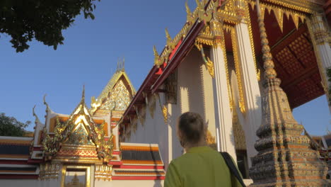 Woman-visiting-Buddhist-Marble-Temple-in-Bangkok-Thailand