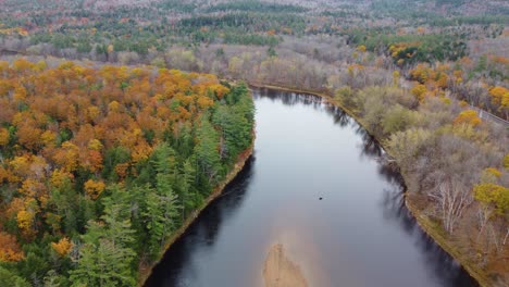Aerial-view-of-a-river-in-the-forest-in-autumn-near-Mount-Washington,-New-Hampshire,-USA