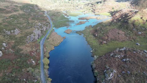Wide-revealing-drone-shot-of-the-river-Loe-in-the-Gap-of-Dunloe-Ireland,-aerial-footage