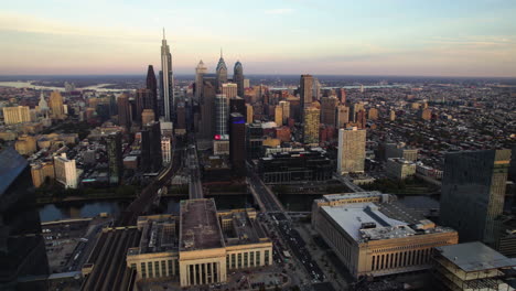 Aerial-view-approaching-downtown-of-Philadelphia,-autumn-evening-in-PA,-USA